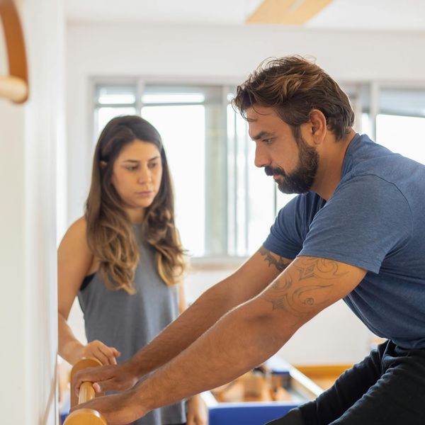 Man doing a stretching exercise, demonstrating balance and core strength.
